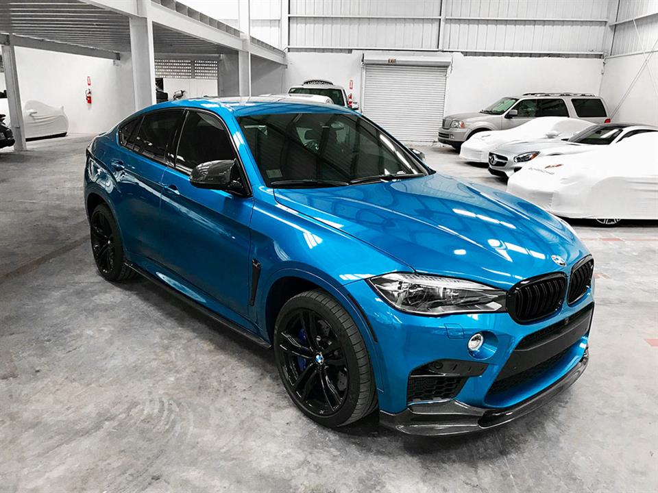 Blue BMW F86 X6M with a set of CF Side Skirt Extensions from RW