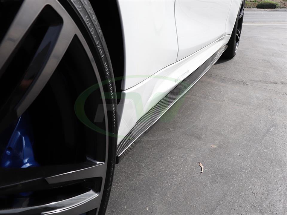 White BMW M2 with carbon fiber side skirt extensions