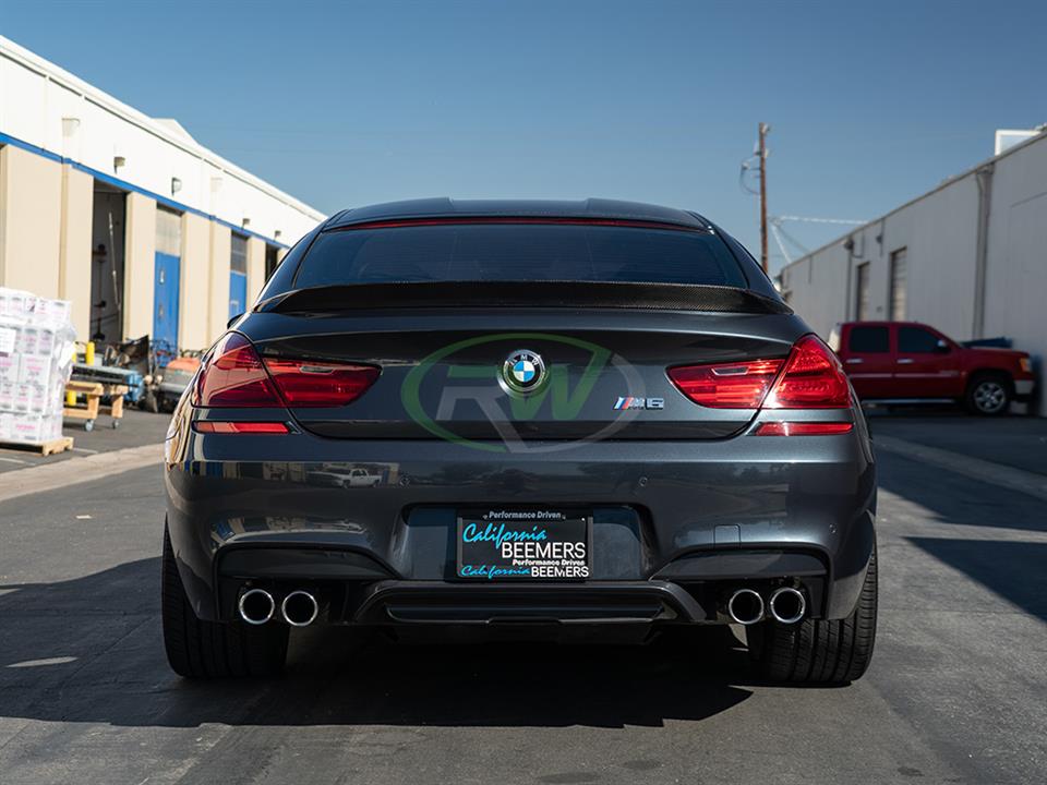 grey M6 with carbon fiber trunk spoiler