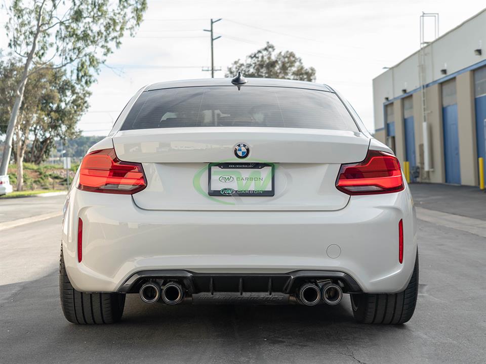 performance style rear diffuser in carbon fiber on white F87 M2