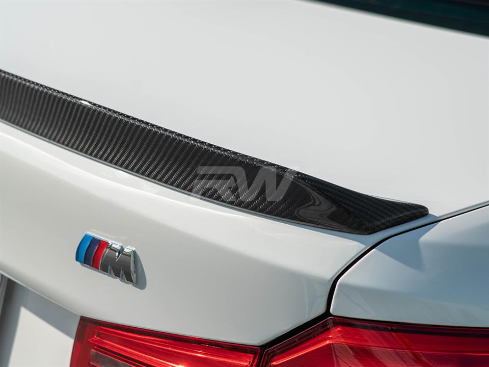 white bmw g30 with a 3d style trunk spoiler from rw