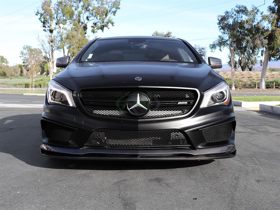 Black Mercedes C117 CLA outfitted with Revo Style Carbon Fiber Front Lip Spoiler